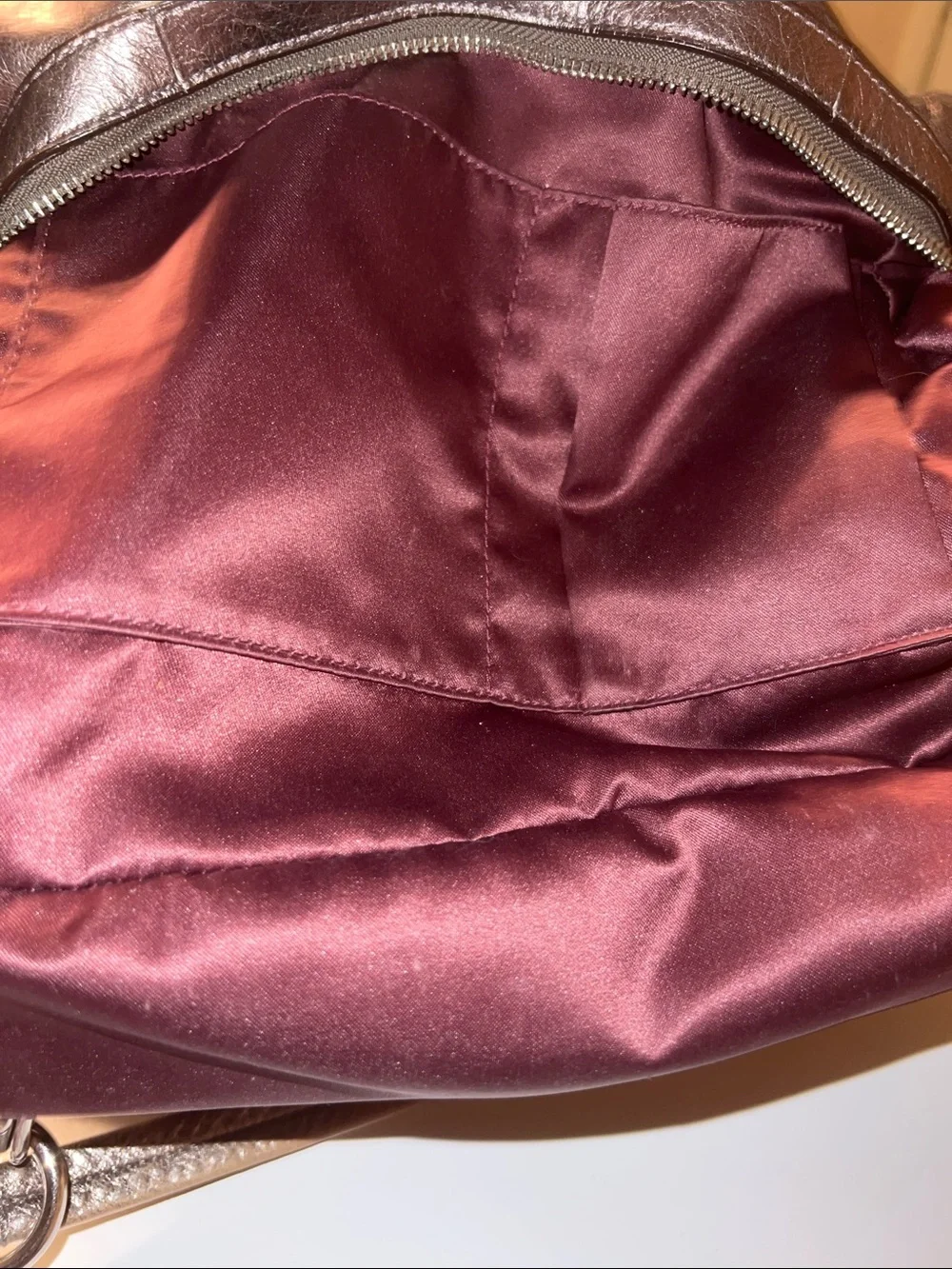 Coach Madison Maggie hobo shoulder bag featuring a metallic gunmetal leather